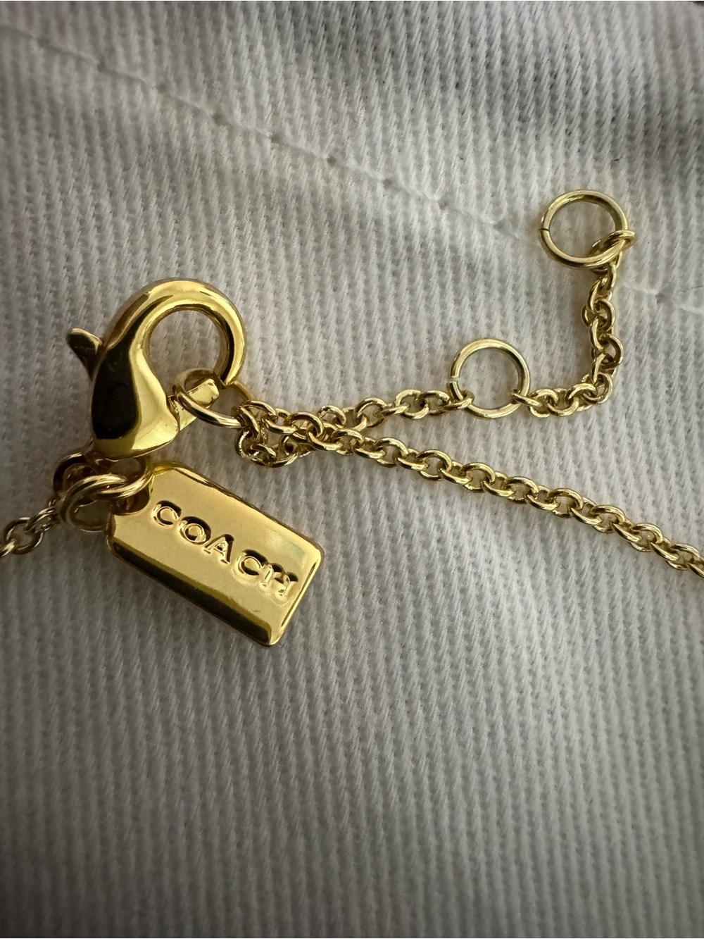 Coach Gold-Tone Logo Tag and Flower Charm Necklace - Picture 2 of 7